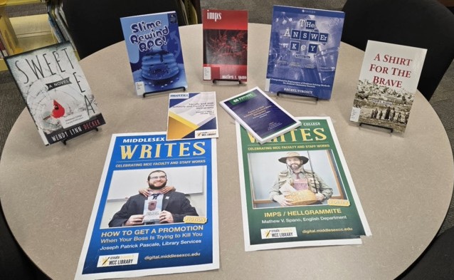 table with book display and posters for the faculty and staff bibliography